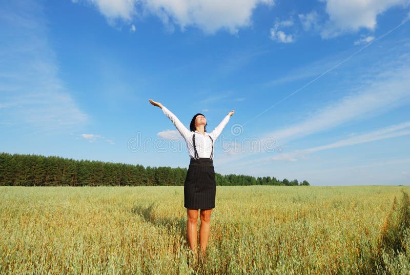 Young agronomist relaxation on a background of blue sky