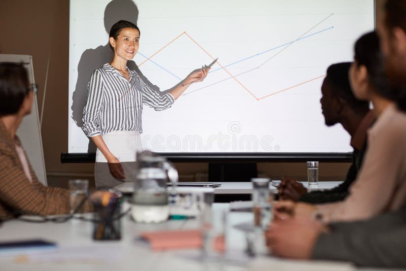 Young analyst pointing at graph royalty free stock photos