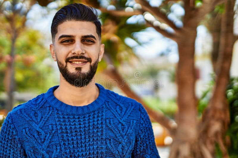 Young arab man smiling confident at park royalty free stock photos