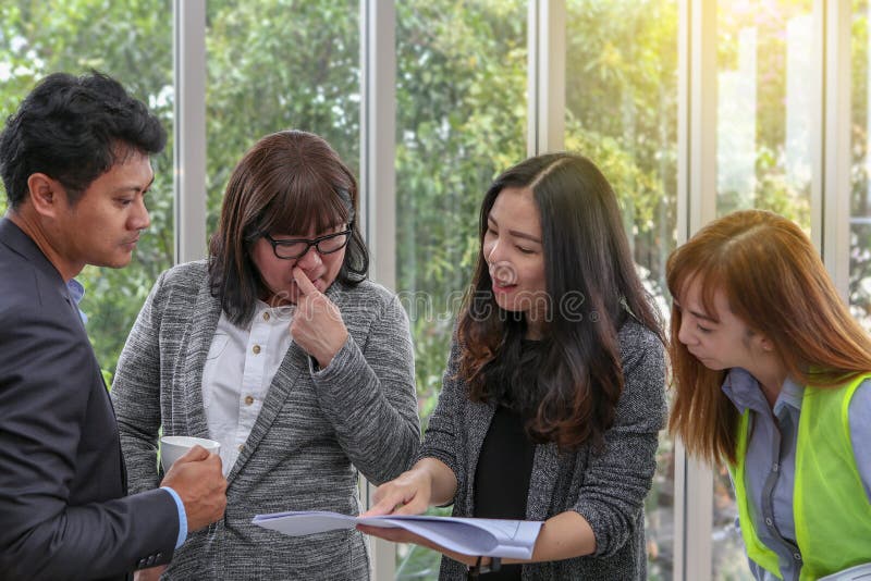 Young architectural team at work. Office worker viewing document stock photos