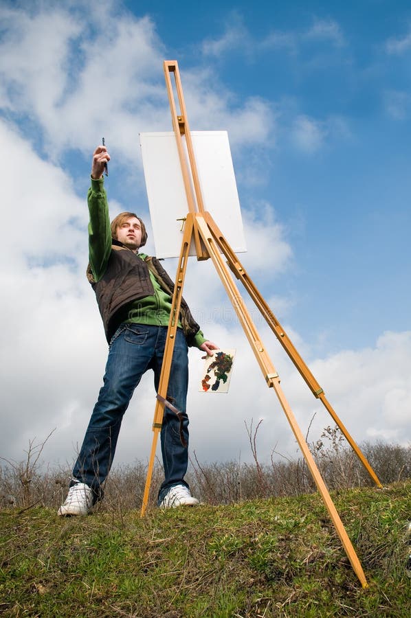 Young artist drawing outdoors stock images
