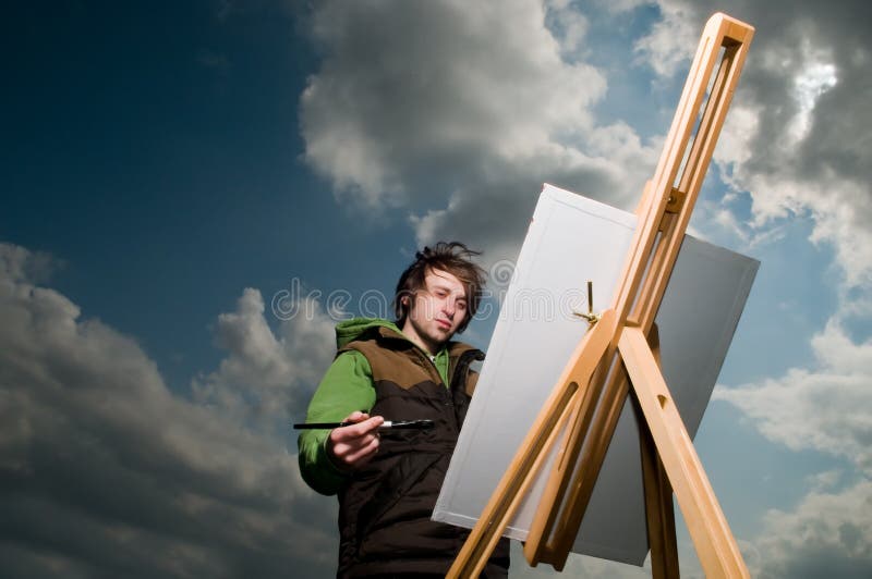 Young artist drawing outdoors royalty free stock photography