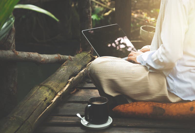 Young asia muslim woman work out office chill on green nature pa