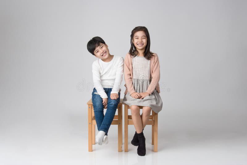 Young Asian brother and sister studio shot