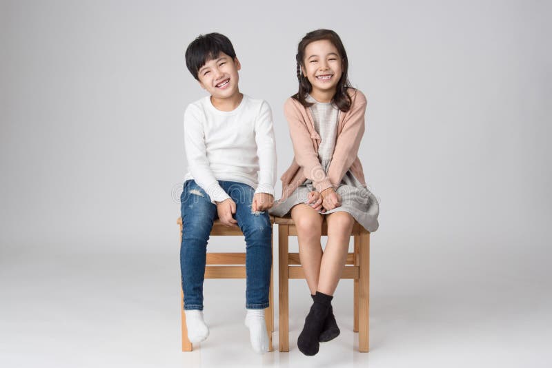 Young Asian brother and sister studio shot