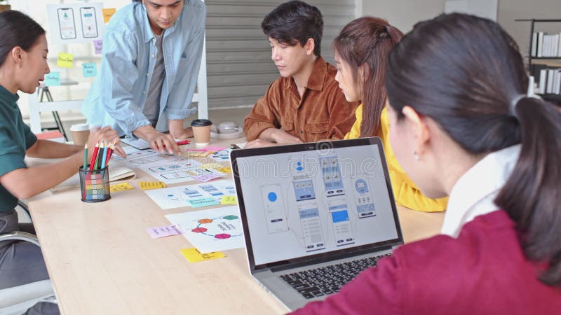 Young Asian business creative team work together, mobile application software design project. Brainstorm meeting concept stock video