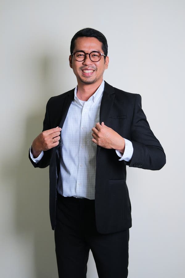 Young Asian Business Man Showing Proud Gesture by Touching His Suit ...