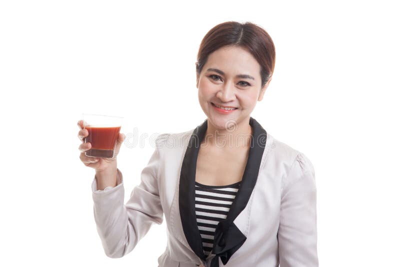Young Asian business woman drink tomato juice.