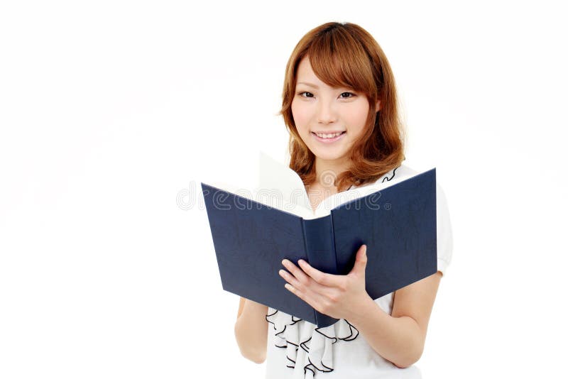 Young asian business woman holding a book