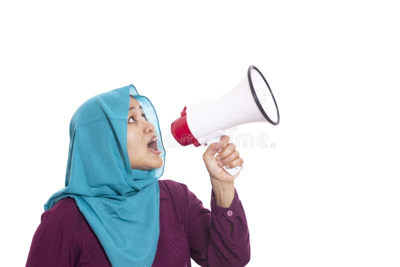 Young Asian businesswoman wearing suit and hijab screaming with an angry expression. Isolated on white. Close up body portrait. Young Asian businesswoman wearing suit and hijab screaming with an angry expression. Isolated on white. Close up body portrait