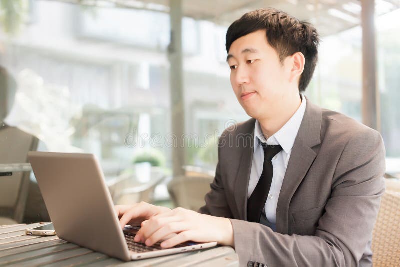 Young Asian casual businessman in outdoor scene. stock image Young Asian casual businessman in outdoor scene. stock image