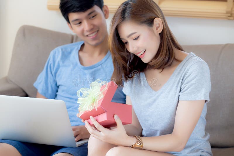 Happy Asian Man Giving Gift Box To His Mother For Mother's Day Celebration.  Stock Photo, Picture and Royalty Free Image. Image 129902480.