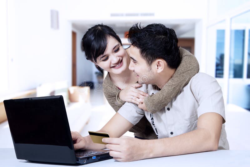 Young asian couple online shopping at home royalty free stock image Young asian couple online shopping at home royalty free stock image