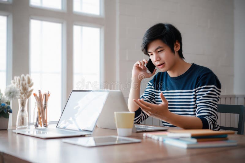 Young Asian Employee Making Phone Call To Customer during Working Day in Home  Office. Working from Home Concept Stock Image - Image of confident, hand:  182694643