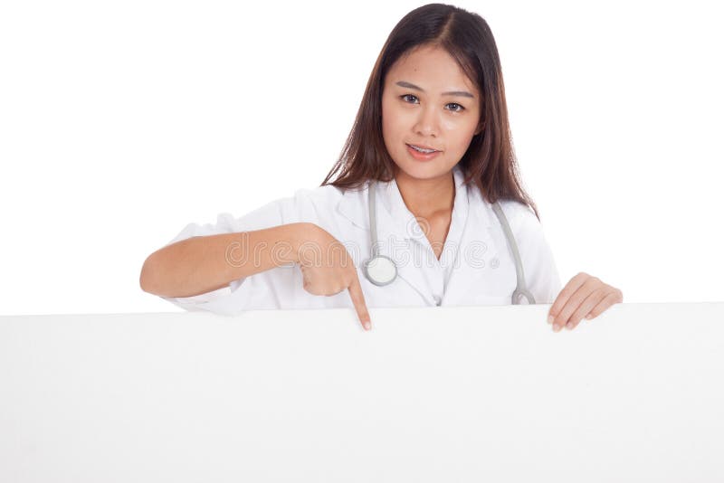 Young Asian female doctor point down to blank sign on white background
