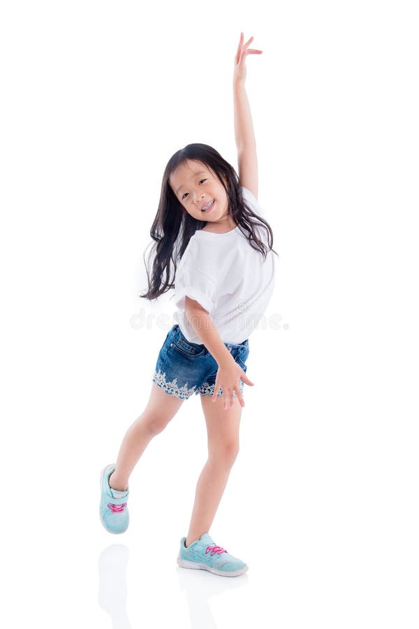 girl dancing and smiles over white background