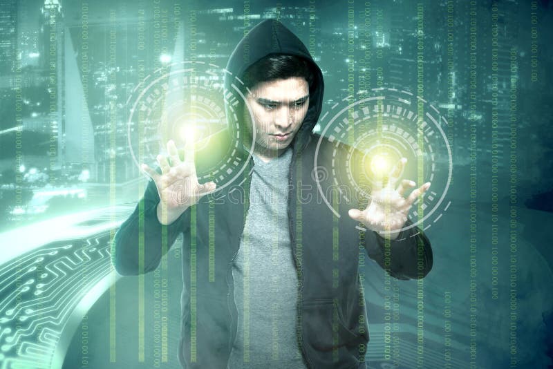 Young asian hacker in black hoodie touching virtual screen with binary code stock photography Young asian hacker in black hoodie touching virtual screen with binary code stock photography