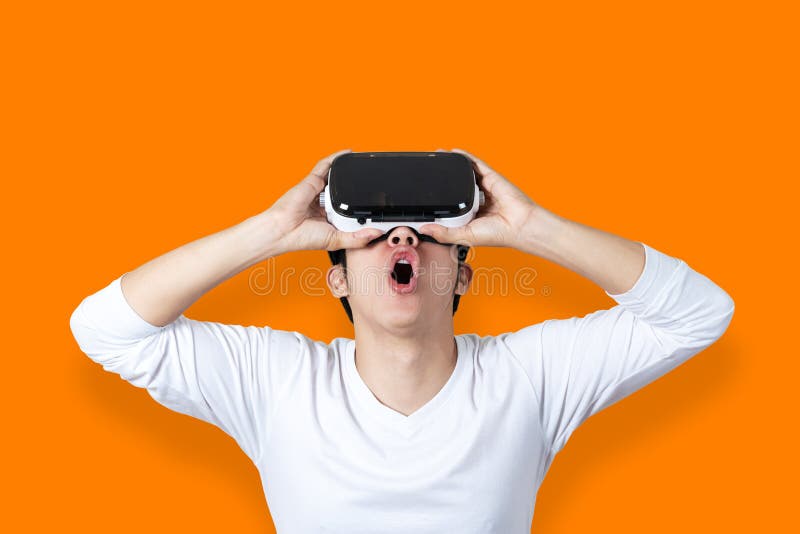 Young Asian Man Amazed By Virtual Reality royalty free stock photography Young Asian Man Amazed By Virtual Reality royalty free stock photography