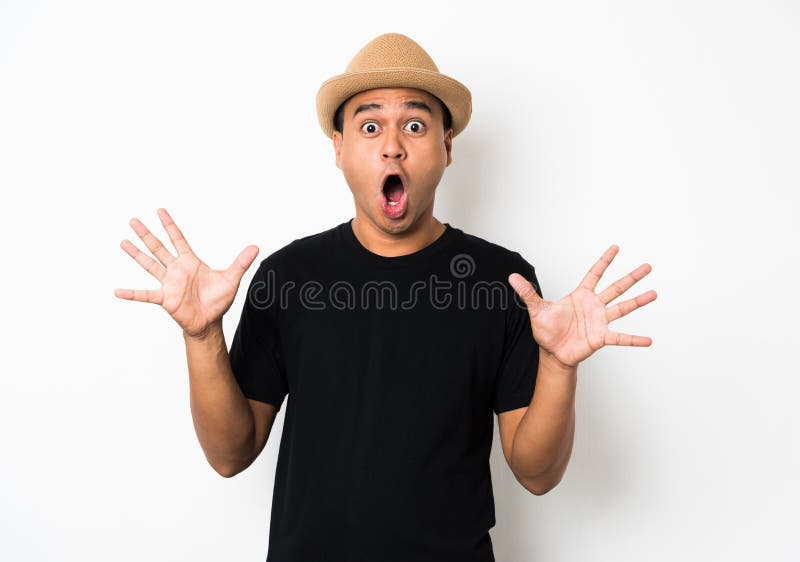 Young Asian man with hat feels shock and surprise with overly face expression. royalty free stock image Young Asian man with hat feels shock and surprise with overly face expression. royalty free stock image