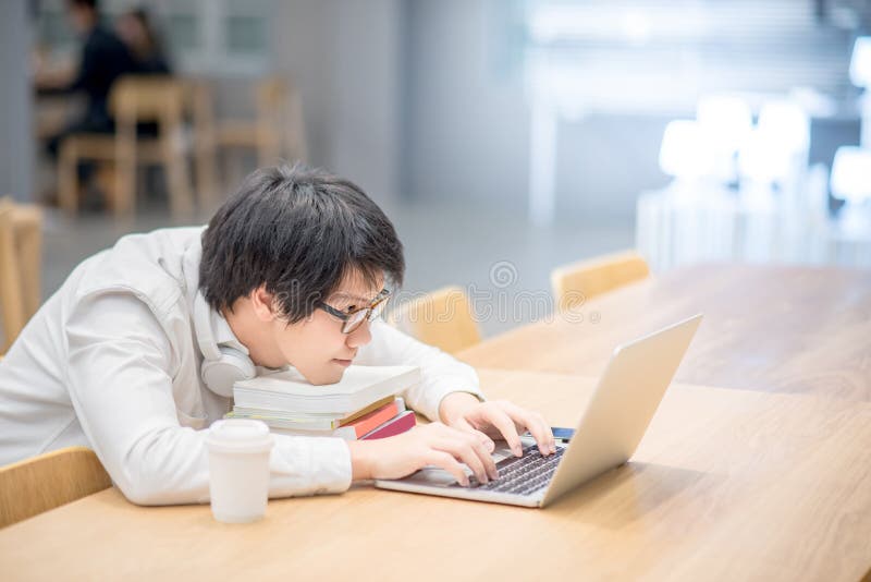 Young Asian Man University Student Doing Homework Stock Photo Imag
