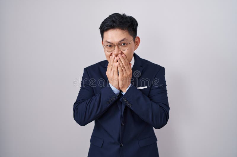 Young Asian Man Wearing Business Suit and Tie Laughing and Embarrassed ...