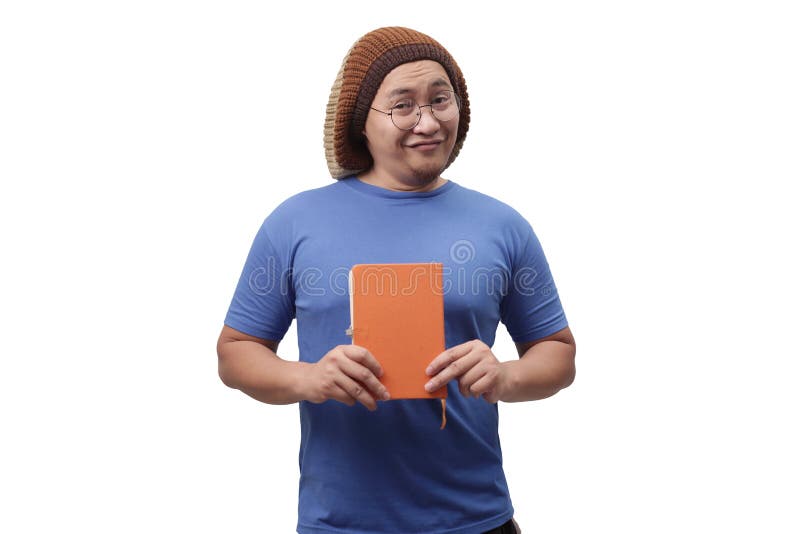 Young Man Holding a Book, Smiling Expression stock image Young Man Holding a Book, Smiling Expression stock image