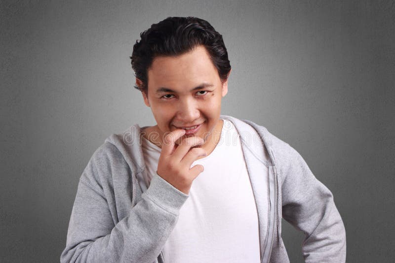 Man Smiling Teasing stock photo. Image of male, emotion 123610472