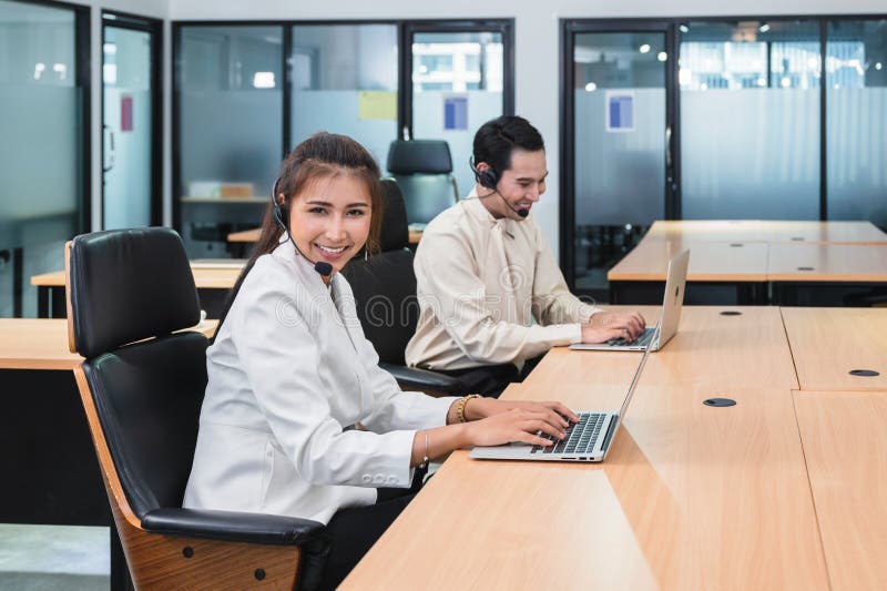 Young asian operator woman agent with headsets working customer service in a call center stock images