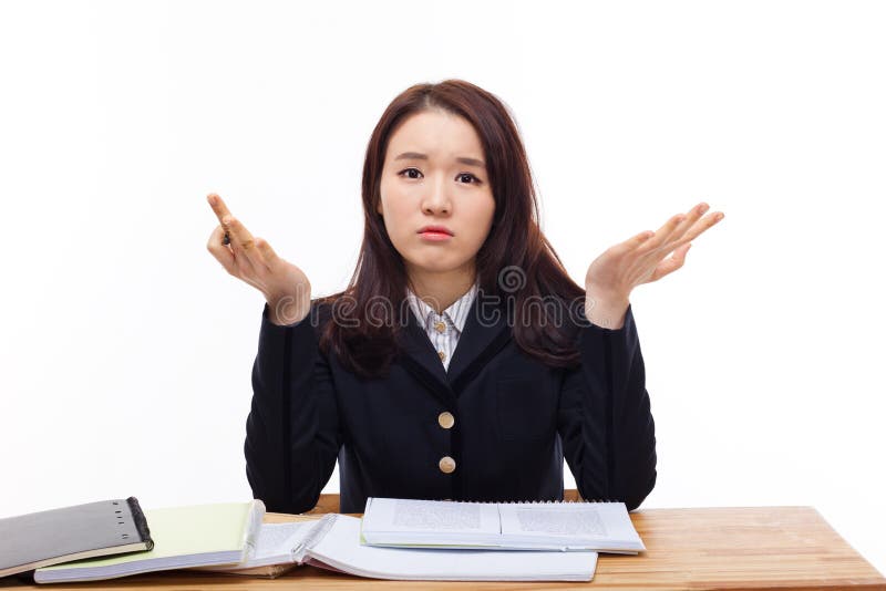 Young Asian student having trouble on desk. royalty free stock images Young Asian student having trouble on desk. royalty free stock images
