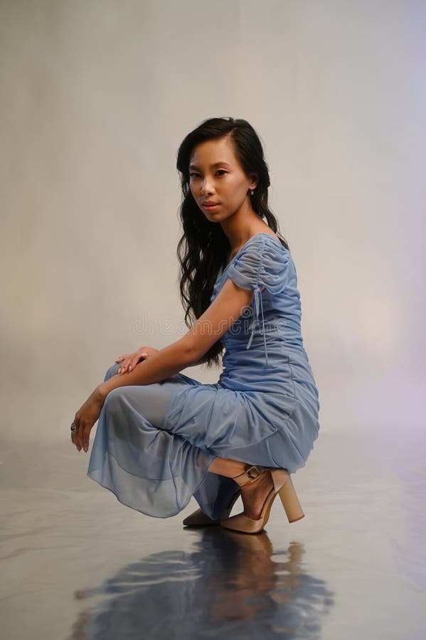 Young asian woman in blue evening dress stock photo