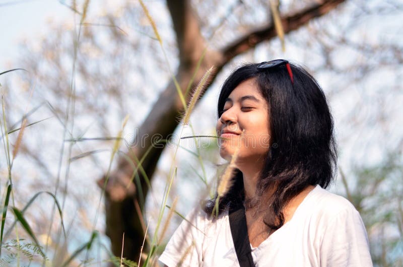 Young asian woman breathing fresh air