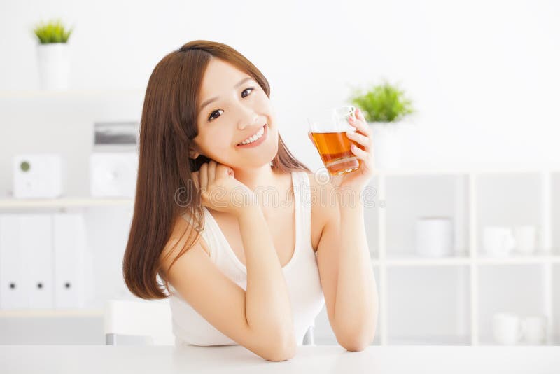 Young asian woman drinking tea