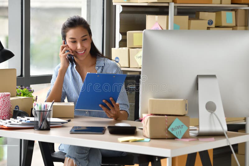 Young Asian woman entrepreneur/ Business owner working with computer at home stock images Young Asian woman entrepreneur/ Business owner working with computer at home stock images