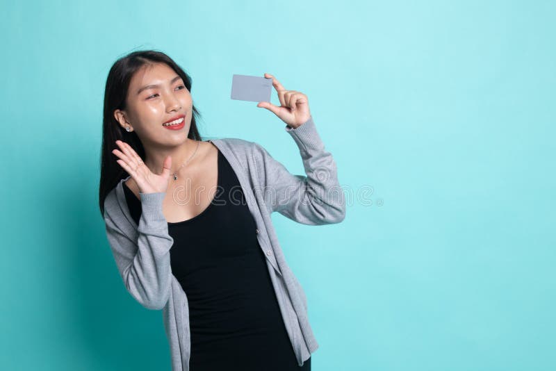 Young Asian woman happy with blank card royalty free stock photo Young Asian woman happy with blank card royalty free stock photo