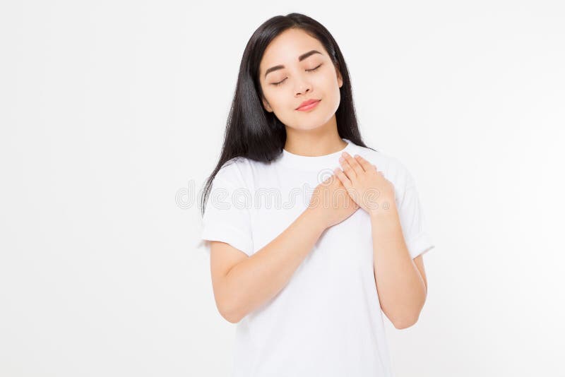 Young asian woman touching heart isolated on white background. Feelings and love concept. Valentine day. Copy space.