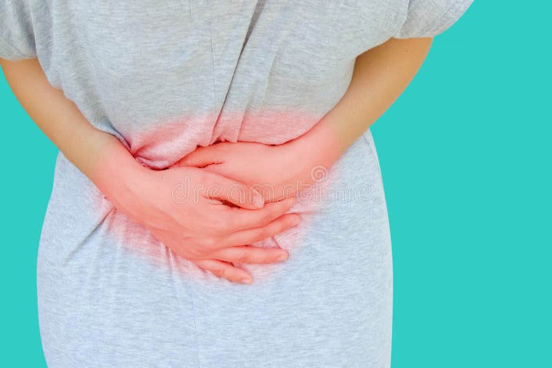 Young asian women hold hands in painful areas which may be caused by gastritis, menstruation period cramp, abdominal pain, stomach stock photography