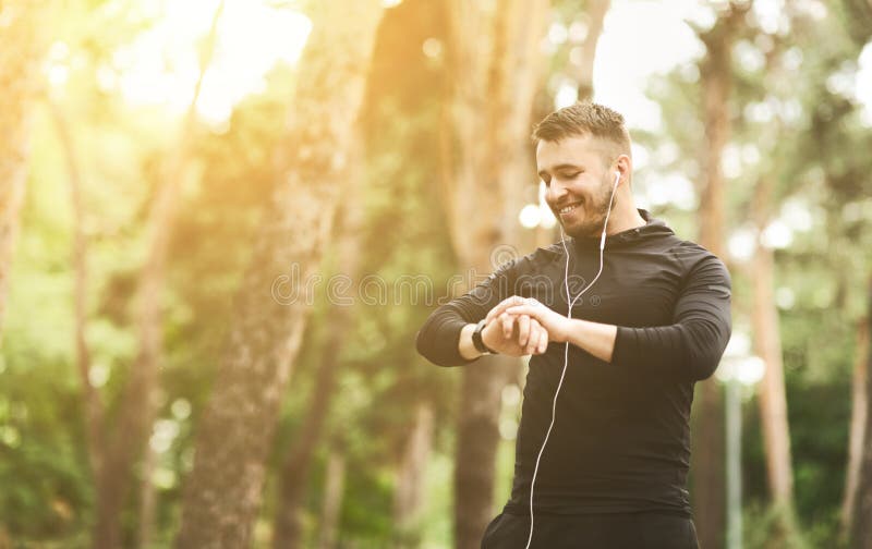 Young athlete checking fitness progress on smart watch stock photo Young athlete checking fitness progress on smart watch stock photo