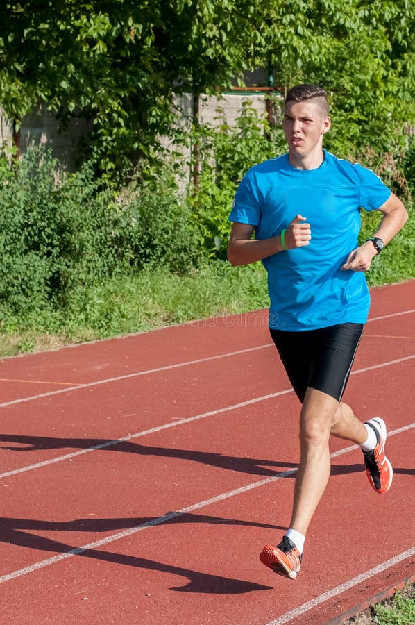 Young Athlete Running on Track Stock Image Image of athlete, track