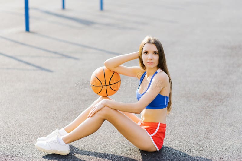 Athletic Girl Holding Up a Basketball Ball Stock Image - Image of  professional, girl: 162615685