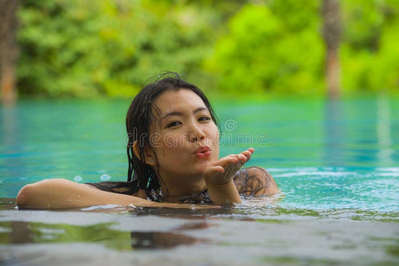 Young Attractive And Beautiful Asian Chinese Woman Relaxing Happy At Tropical Beach Resort