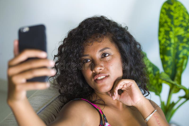 Young Attractive And Beautiful Happy Black Latin American Woman Taking Selfie Portrait Picture 