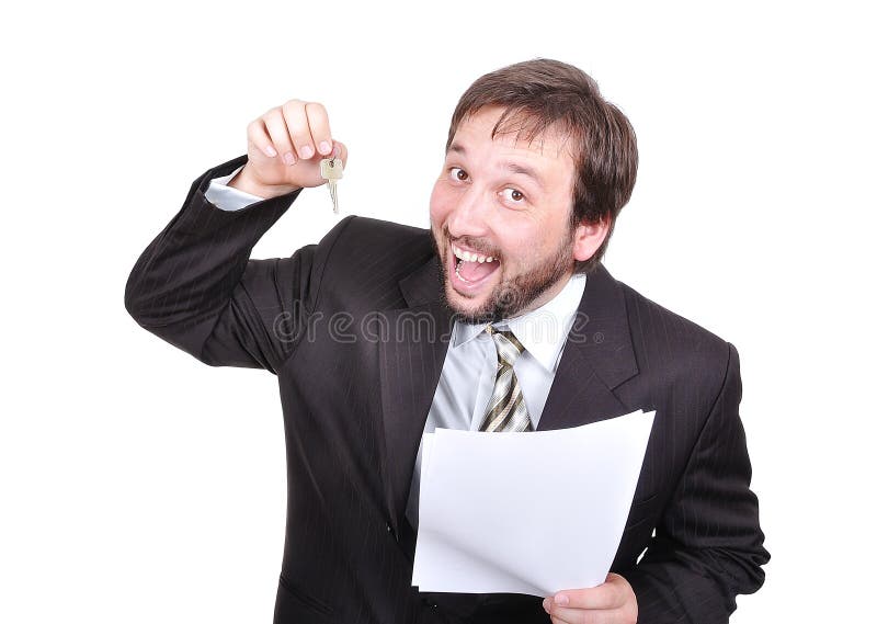 Young attractive businessman with keys and paper o