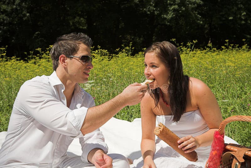 Young attractive couple having a picknick