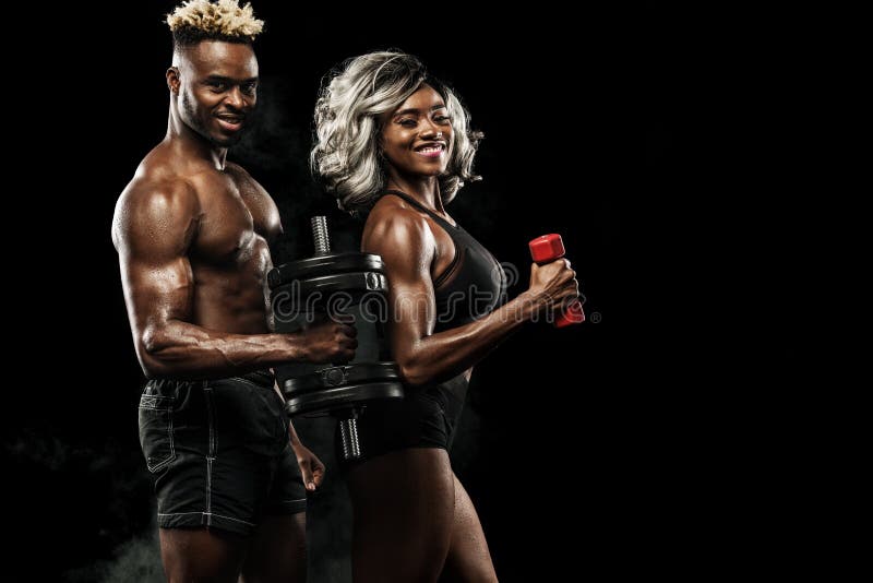 Fitness couple of athletes posing on black background, healthy lifestyle body care. Sport concept with copy space. stock images Fitness couple of athletes posing on black background, healthy lifestyle body care. Sport concept with copy space. stock images