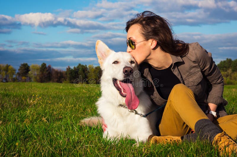 Young attractive girl with her pet dog