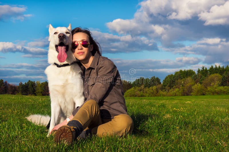 Young attractive girl with her pet dog