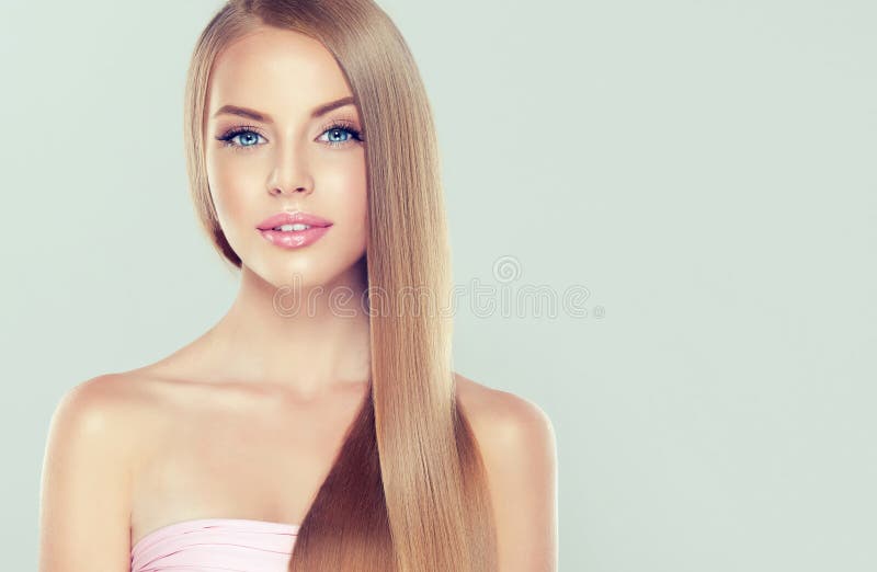 Young attractive girl-model with gorgeous, shiny, long, blond hair. Close-up portrait of young attractive girl-model with gorgeous, shiny, long, blond hair and royalty free stock photos Young attractive girl-model with gorgeous, shiny, long, blond hair. Close-up portrait of young attractive girl-model with gorgeous, shiny, long, blond hair and royalty free stock photos