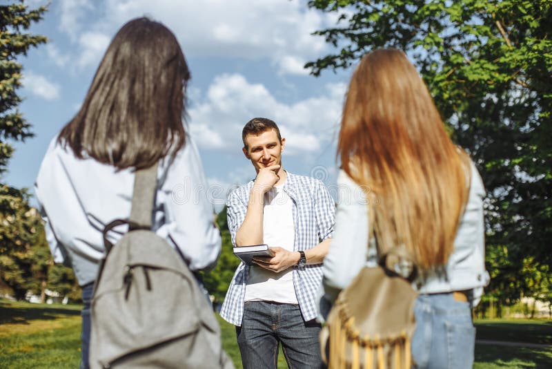 Young Attractive Guy Making A Choice Between Two Girls Love Triangle 