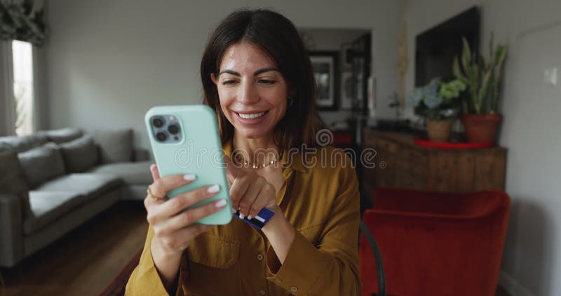 Young attractive Hispanic woman doing online shopping at home stock video footage