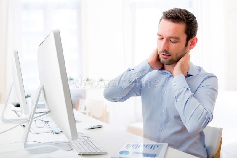 Young attractive man got a neck pain at the office